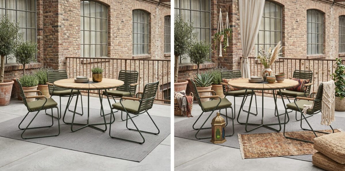 Runder Tisch mit vier schlanken Stühlen auf der Terrasse eines Industrie-Lofts